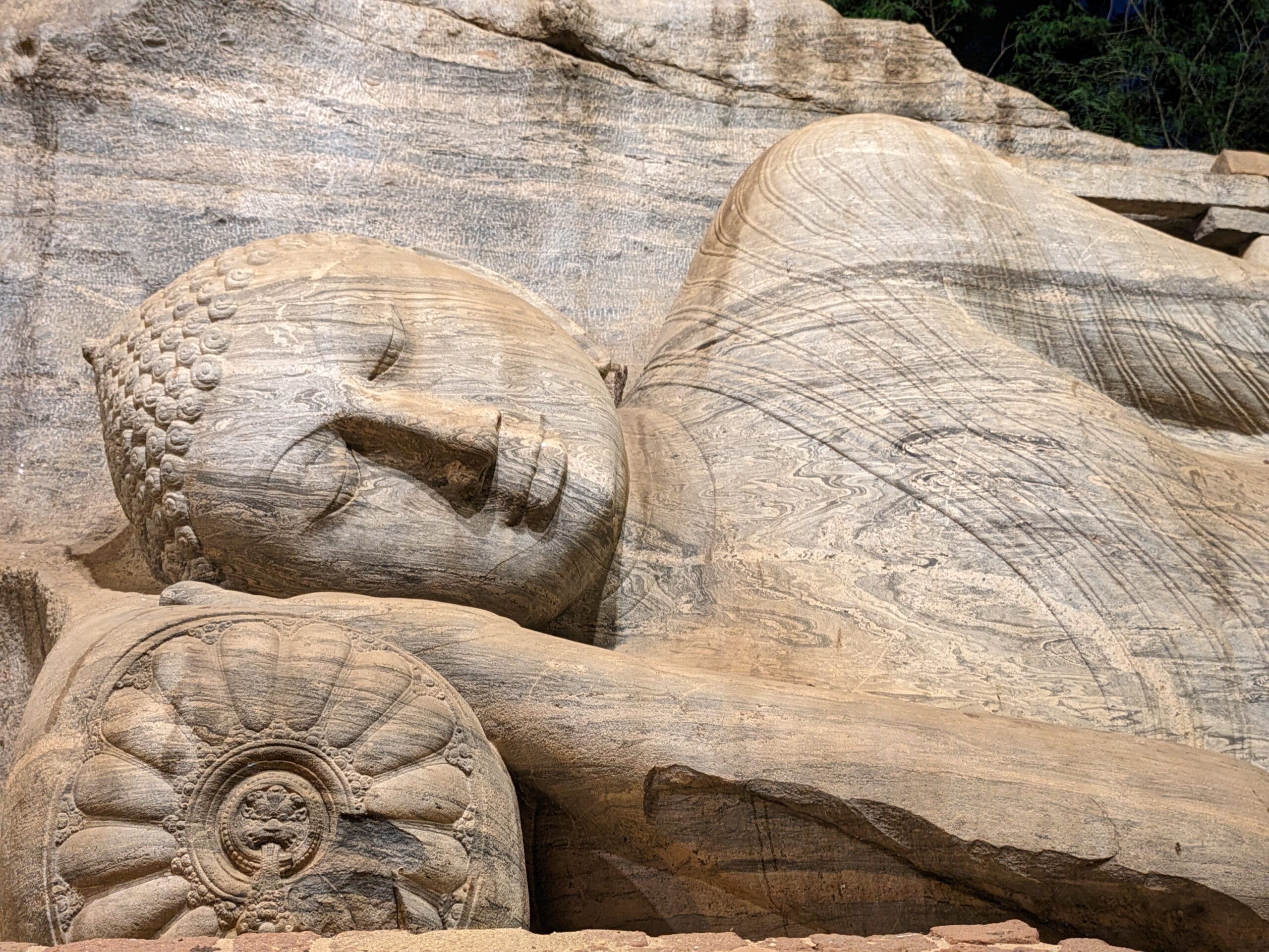 Detailed carving in lying Buddha at Polonnaruwa